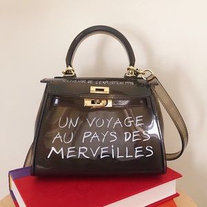Un Voyage Au Pays des Merveilles grey PVC mini bag